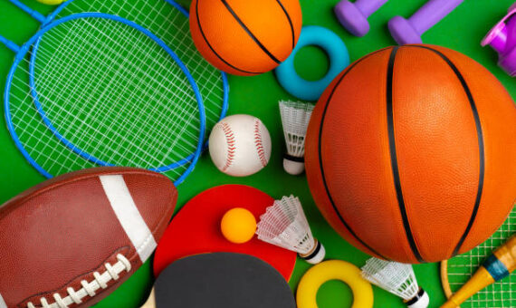 Composition of various sport equipment for fitness and games. Close up.